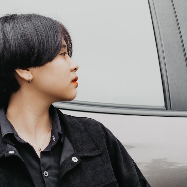 Kaveri Mehta, Lead Design Curator at GreenMarketCraft, reviewing corporate floral arrangements